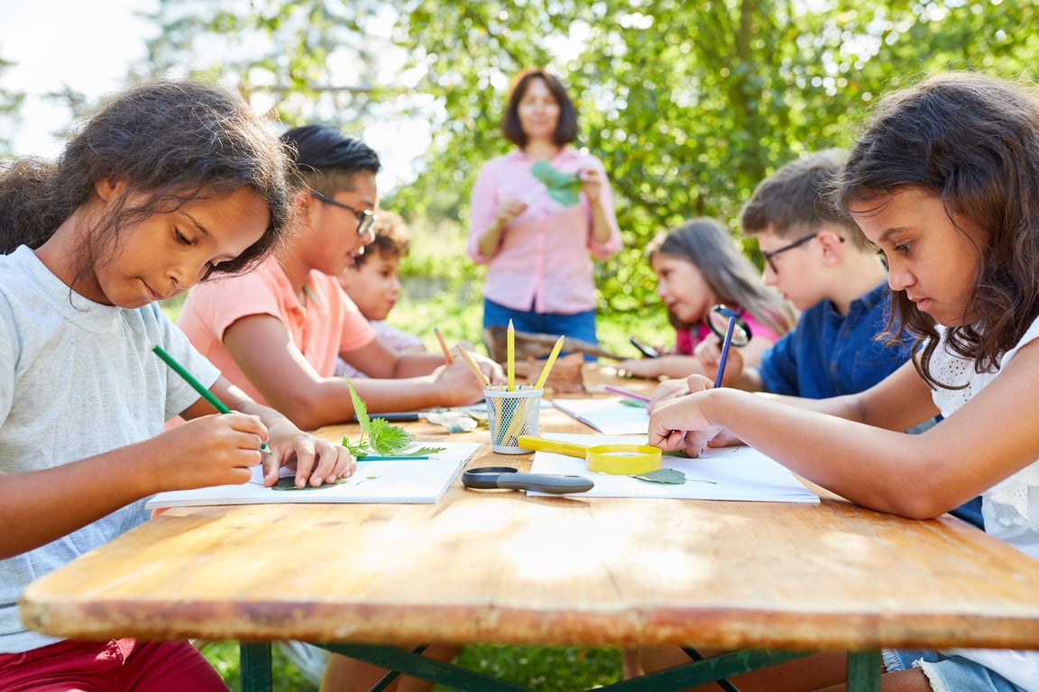 Children in Summer Camp Drawing and Doing Handicrafts