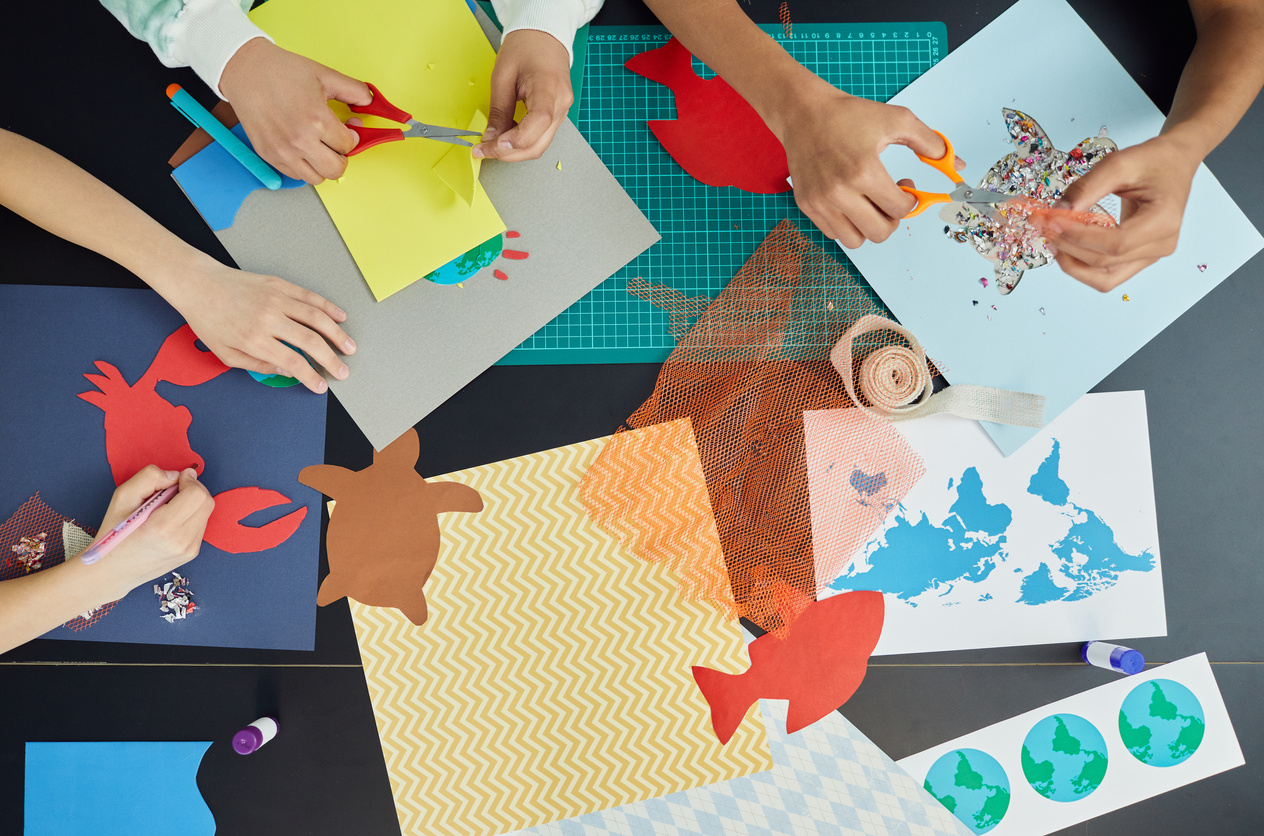 Crop group of children making drawings